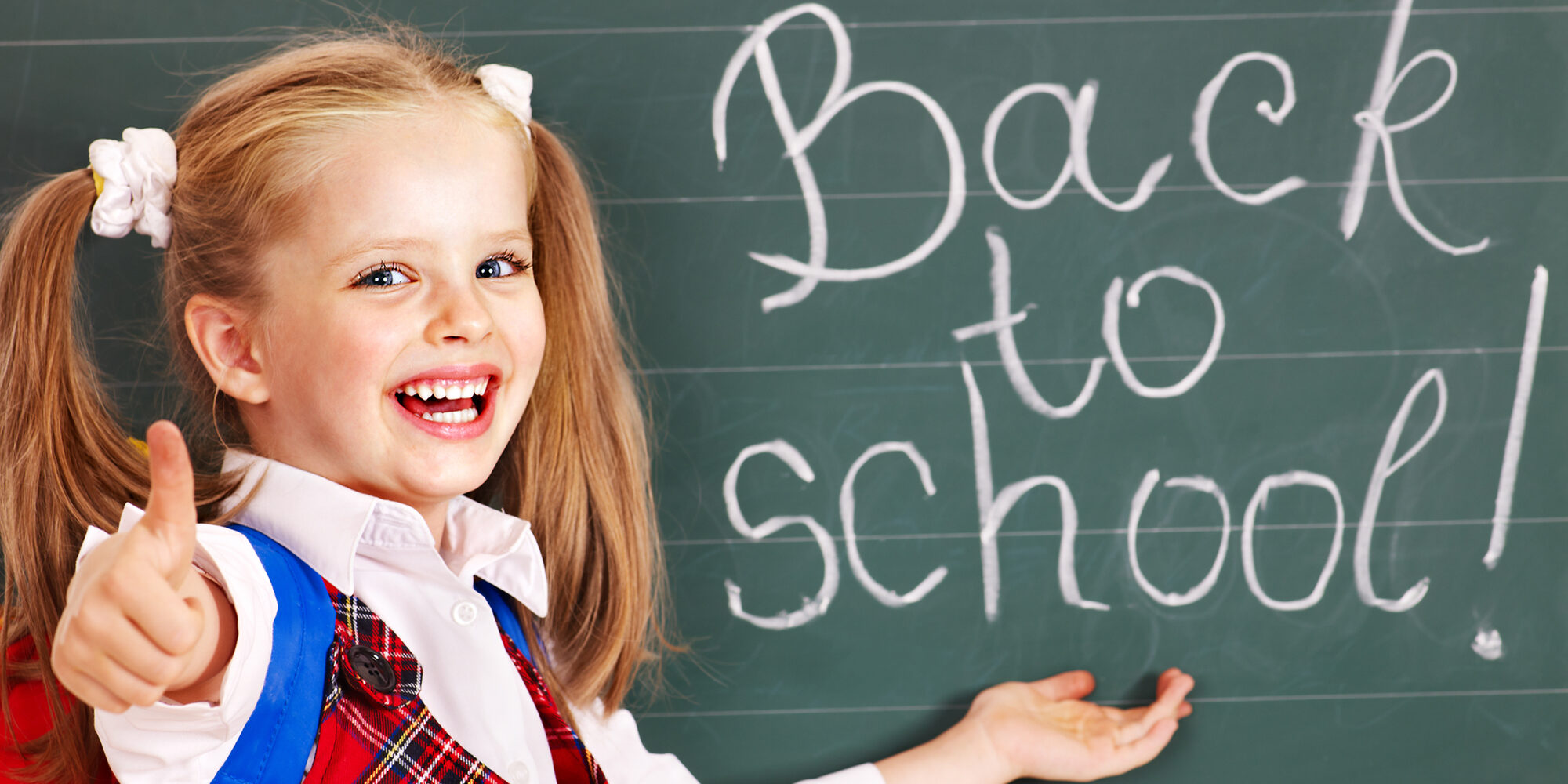 Smiling girl on first day of school