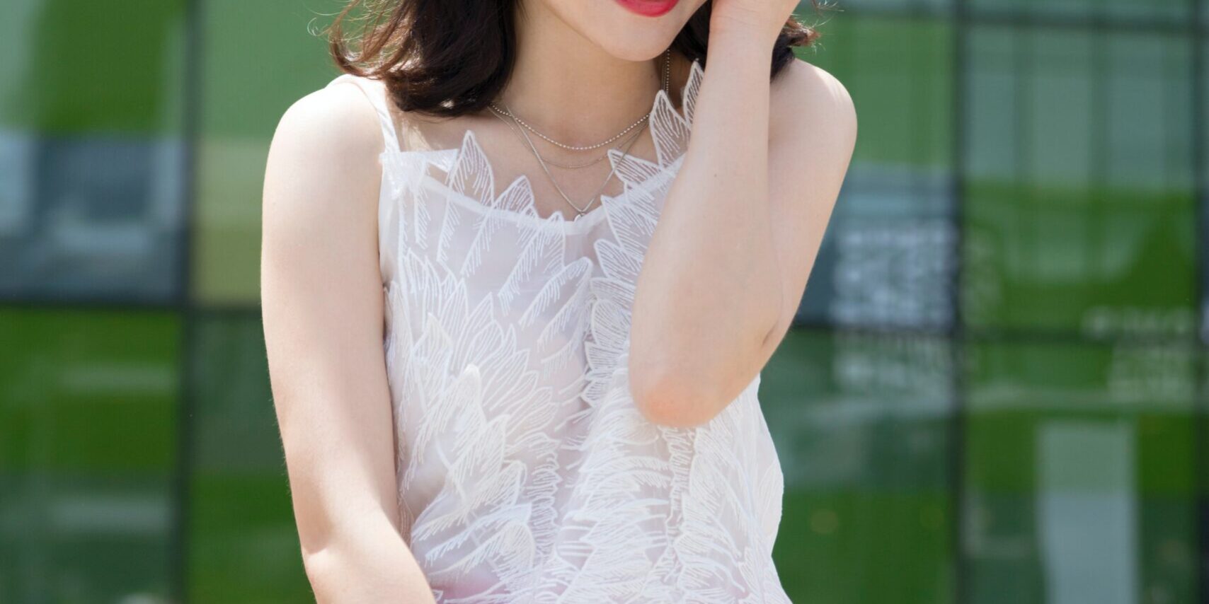 Young Asian woman smiles after visiting a dentist at Chisholm Trail
