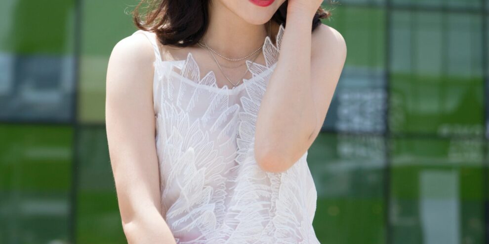 Young Asian woman smiles after visiting a dentist at Chisholm Trail