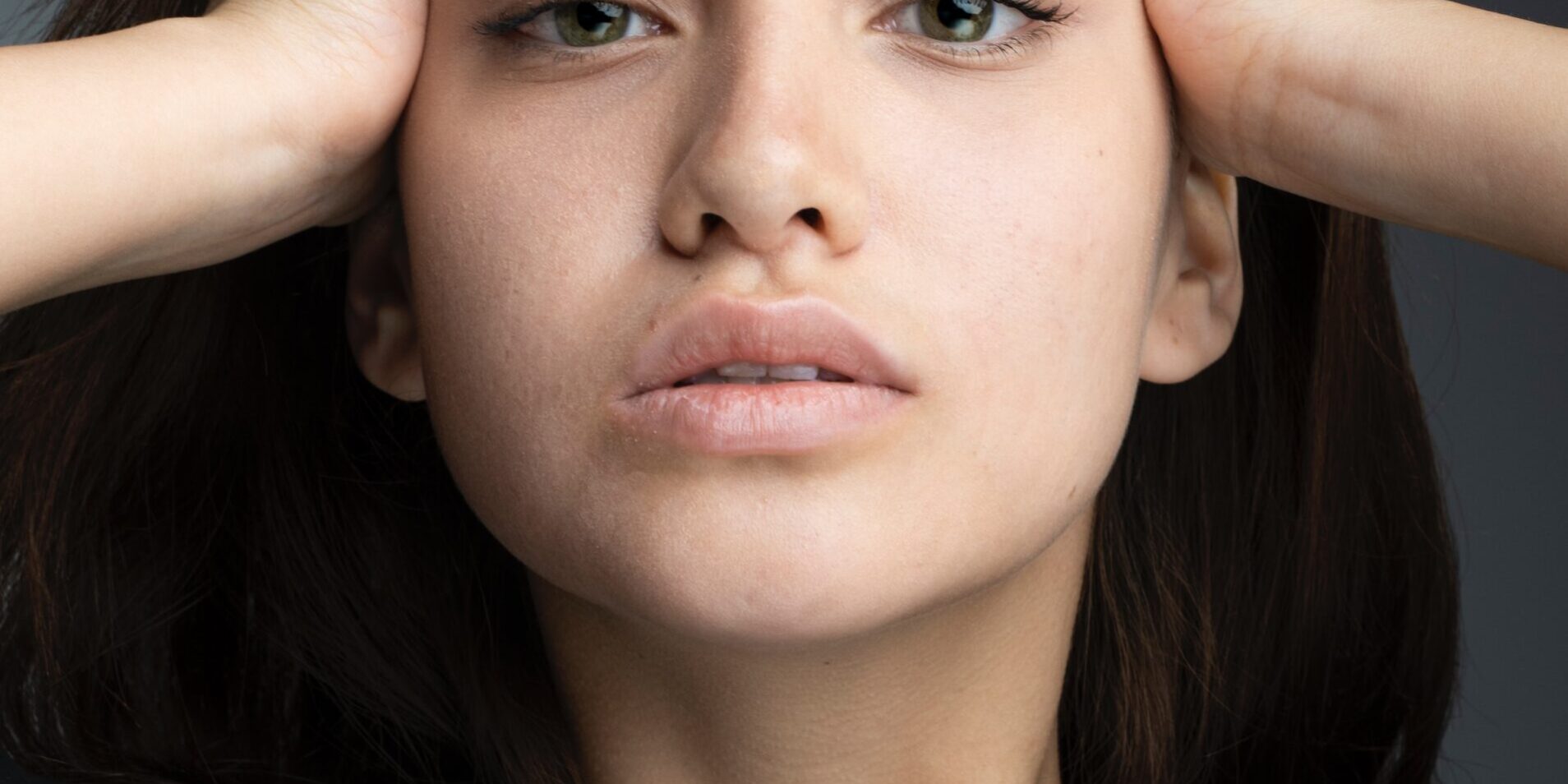 Woman with her hands on her head