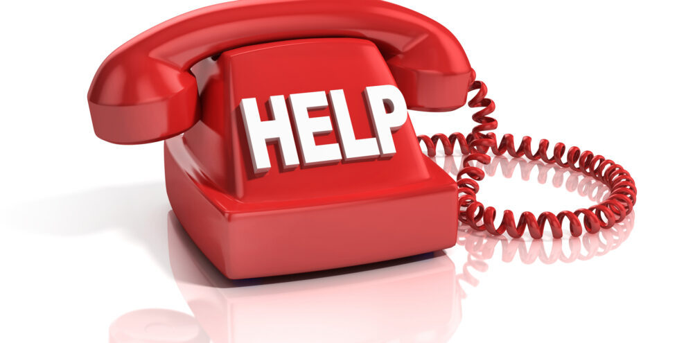 red phone with "help" written across it