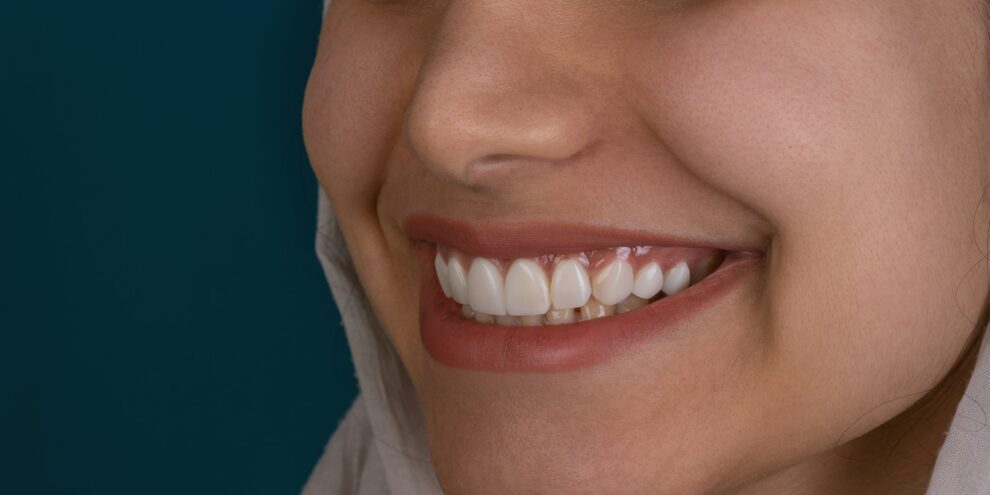 woman smiling on black background