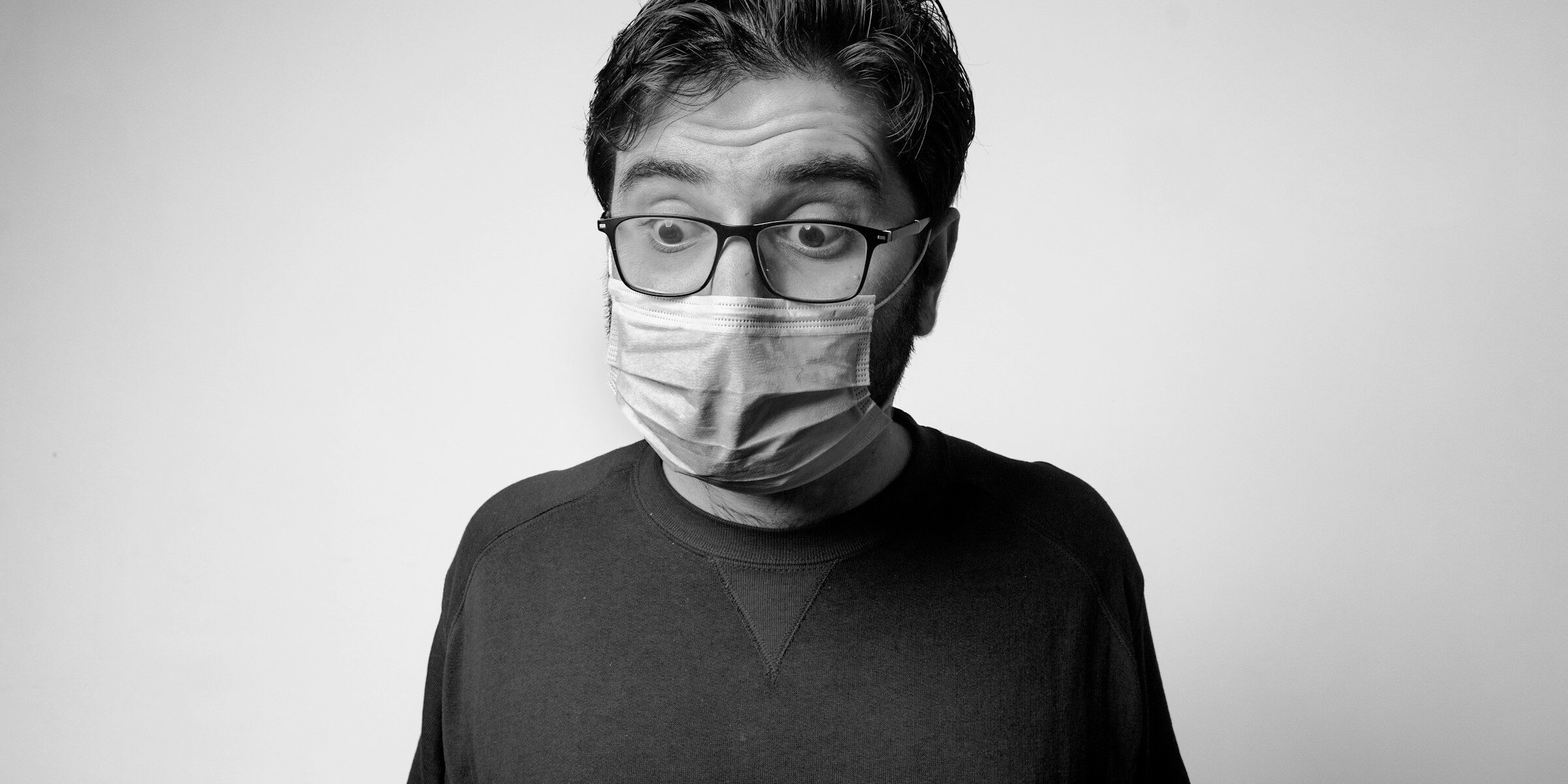 Surprised man in face mask