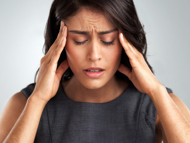 female professional with tmd headache pain