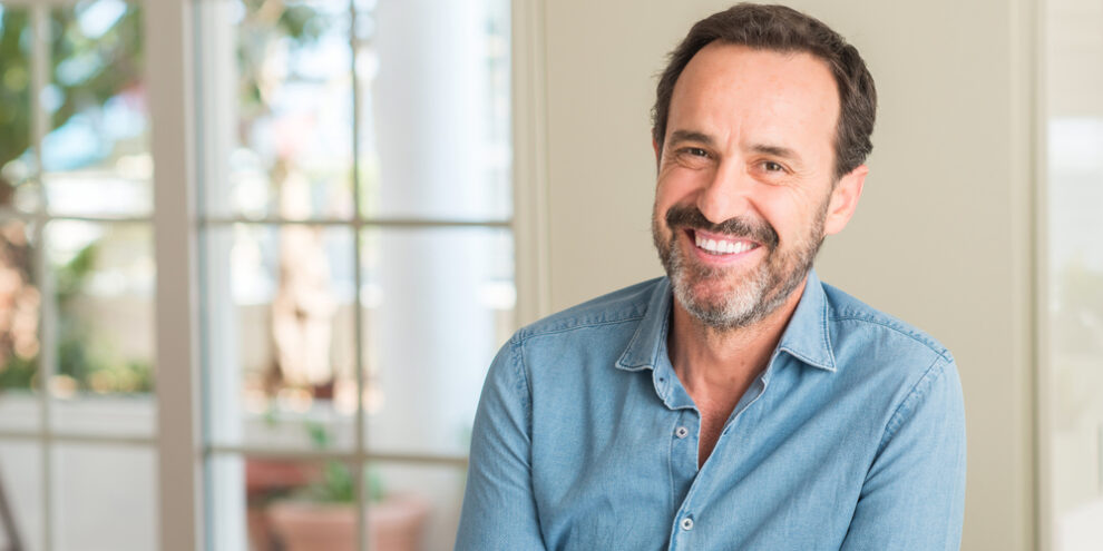 senior man smiling after mouth reconstruction