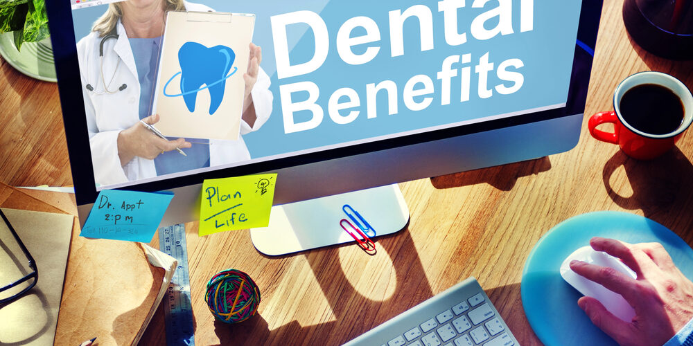 dental benefits on computer screen with sticky notes