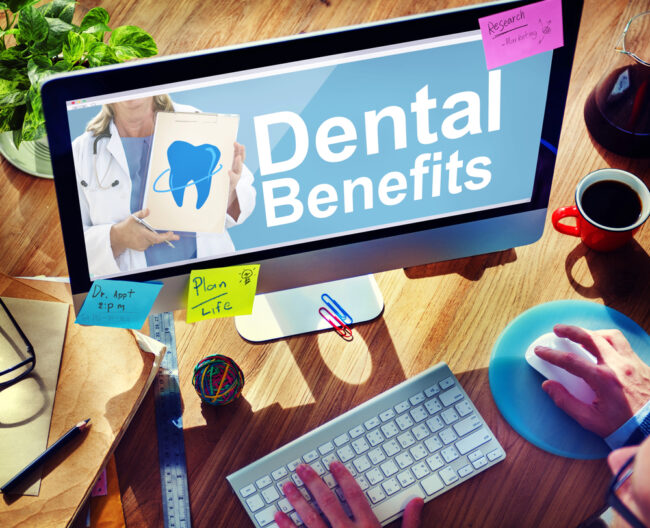 dental benefits on computer screen with sticky notes