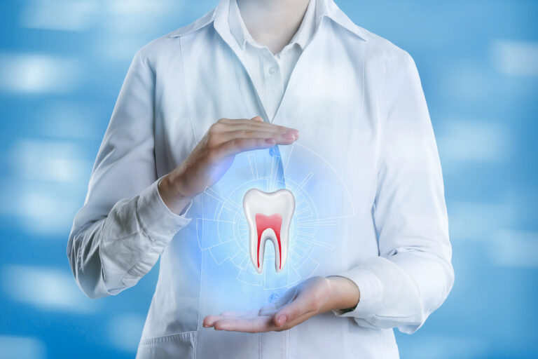 Dentist showing virtual model of tooth on light blue background